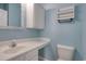 This bathroom offers a white vanity, coordinating mirror, storage, and wall shelving at 130 Scotch Broom Dr. # H-103, Little River, SC 29566