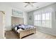 Bright bedroom with a ceiling fan, a window for natural light, and neutral color scheme at 130 Scotch Broom Dr. # H-103, Little River, SC 29566