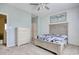 Cozy bedroom features carpet, ceiling fan, a dresser, and a comfortable bed for relaxation at 130 Scotch Broom Dr. # H-103, Little River, SC 29566