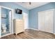 This bedroom offers wood floors, a TV, storage and an adjacent bathroom at 130 Scotch Broom Dr. # H-103, Little River, SC 29566