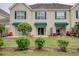 This townhome shows a manicured front lawn and shaded patio area at 130 Scotch Broom Dr. # H-103, Little River, SC 29566