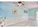 Inviting living room with beachy decor, ceiling fan, and wainscoting for a cozy coastal vibe at 130 Scotch Broom Dr. # H-103, Little River, SC 29566
