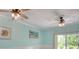 Bright living area with dual ceiling fans, seafoam walls, sliders to backyard and coastal decor at 130 Scotch Broom Dr. # H-103, Little River, SC 29566