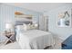 Cozy bedroom featuring soothing colors, a comfortable bed, and paddle decorations at 1301 Bay View Ct., North Myrtle Beach, SC 29582