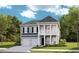 Charming two-story home with a welcoming front porch and a two-car garage at 1301 Bay View Ct., North Myrtle Beach, SC 29582