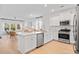 Modern kitchen with stainless steel appliances, a center island, and seamless flow to the living area at 1301 Bay View Ct., North Myrtle Beach, SC 29582