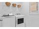 Well-equipped laundry room with modern washer and dryer and ample storage space at 1301 Bay View Ct., North Myrtle Beach, SC 29582