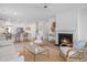 Bright and airy living room with a cozy fireplace, seamlessly connected to the modern kitchen at 1301 Bay View Ct., North Myrtle Beach, SC 29582