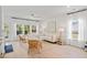 Spacious living room with large windows, comfortable seating, and an open layout, perfect for entertaining at 1301 Bay View Ct., North Myrtle Beach, SC 29582