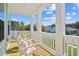 Inviting front porch with rocking chairs and views of the neighborhood at 1301 Bay View Ct., North Myrtle Beach, SC 29582