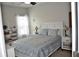 Bright bedroom with large bed, fresh linens, and ample natural light, creating a serene and comfortable atmosphere at 1308 Riverport Dr., Conway, SC 29526