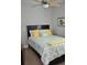 Comfortable bedroom with a dark wood bed frame, patterned bedding, and a ceiling fan at 1308 Riverport Dr., Conway, SC 29526