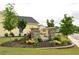 The Carson's Ferry neighborhood entrance sign, surrounded by manicured landscaping and flowering plants at 1308 Riverport Dr., Conway, SC 29526