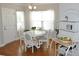 Dining room area with hardwood floors, natural light, and stylish decor at 1308 Riverport Dr., Conway, SC 29526
