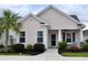 Charming single-story home featuring a manicured lawn and a welcoming covered front porch at 1308 Riverport Dr., Conway, SC 29526