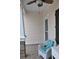 Cozy front porch with a wicker chair and accent pillows, offering a comfortable and inviting outdoor space at 1308 Riverport Dr., Conway, SC 29526