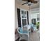 Charming front porch featuring cozy wicker chairs with plush pillows and stylish shutters on the windows at 1308 Riverport Dr., Conway, SC 29526