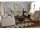 Spacious living room featuring hardwood floors, neutral couches, patterned rug and ample natural light at 1308 Riverport Dr., Conway, SC 29526
