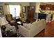 Inviting living room with hardwood floors, neutral furniture, fireplace and open kitchen view at 1308 Riverport Dr., Conway, SC 29526