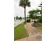 A winding brick pathway through a landscaped garden, leading towards a glimpse of the community at 1308 Riverport Dr., Conway, SC 29526