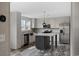 A kitchen with an island, stainless appliances, and bright wood cabinets and flooring at 1310 Rabbit Ln., Conway, SC 29526