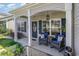 Inviting front porch with rocking chairs and nautical decor, perfect for relaxing outdoors at 149 Tomoka Trail, Longs, SC 29568