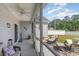 Relaxing screened porch with outdoor seating and serene views of the backyard at 149 Tomoka Trail, Longs, SC 29568