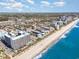 Panoramic aerial view showcasing a coastal community near the sparkling blue sea and local cityscape at 1501 S Ocean Blvd. # 1044, Myrtle Beach, SC 29577