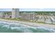 Aerial view of resort buildings, beach, and Atlantic ocean with sunny skies at 1501 S Ocean Blvd. # 1044, Myrtle Beach, SC 29577