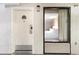 The exterior of a hotel room door with a window showing the bedroom interior with a comfortable queen bed at 1501 S Ocean Blvd. # 1044, Myrtle Beach, SC 29577