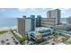 A view of the Landmark Resort with a large building near the beach and the beach across the street at 1501 S Ocean Blvd. # 1044, Myrtle Beach, SC 29577