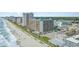 Panoramic aerial view of an oceanfront resort along a picturesque beach, perfect for a coastal getaway at 1501 S Ocean Blvd. # 842, Myrtle Beach, SC 29577