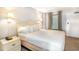 Bright bedroom with plush white bedding and soft bedside lighting at 1501 S Ocean Blvd. # 842, Myrtle Beach, SC 29577