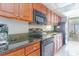 Fully equipped kitchen with modern appliances and granite countertops at 1501 S Ocean Blvd. # 842, Myrtle Beach, SC 29577
