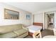 Comfortable living area featuring couch, bed, table and chairs, and neutral decor at 1501 S Ocean Blvd. # 842, Myrtle Beach, SC 29577