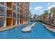 A large pool with a decorative feature stretches out in front of a condo with private balconies at 1501 S Ocean Blvd. # 842, Myrtle Beach, SC 29577