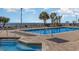 Outdoor pool featuring palm trees, lounge chairs, and a beautiful ocean view at 1501 S Ocean Blvd. # 842, Myrtle Beach, SC 29577