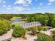 Aerial view of the community clubhouse with a lake, golf course, and parking at 1504 Sedgefield Dr., Murrells Inlet, SC 29576