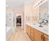 Primary bathroom with double sink vanity, glass shower, and large walk-in closet at 1504 Sedgefield Dr., Murrells Inlet, SC 29576