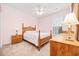 Bedroom with neutral carpet, wood furniture, floral bedding and natural light at 1504 Sedgefield Dr., Murrells Inlet, SC 29576
