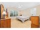 Bright bedroom featuring a vaulted ceiling, large window and a ceiling fan at 1504 Sedgefield Dr., Murrells Inlet, SC 29576