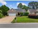 Charming single-story brick home with a well-maintained front lawn and attached garage at 1504 Sedgefield Dr., Murrells Inlet, SC 29576