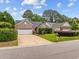 Attractive brick home featuring an attached two-car garage, manicured landscaping, and a welcoming driveway at 1504 Sedgefield Dr., Murrells Inlet, SC 29576