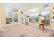 Bright living room with large windows, lamps, and neutral carpeting at 1504 Sedgefield Dr., Murrells Inlet, SC 29576