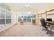 Living room with cathedral ceilings, walls of windows, and natural light at 1504 Sedgefield Dr., Murrells Inlet, SC 29576