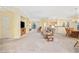 Bright, open-concept living space with carpet, neutral walls, and furniture at 1504 Sedgefield Dr., Murrells Inlet, SC 29576