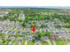 This aerial shot shows the neighborhood with beautiful landscaping, ponds, and community amenities at 155 Marsh Deer Place, Surfside Beach, SC 29575