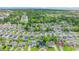 An aerial view showcasing the real estate, highlighting its proximity to a pond and lush trees at 155 Marsh Deer Place, Surfside Beach, SC 29575
