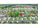 Aerial shot of a neighborhood, with lush trees, well-maintained lawns, and beautiful homes at 155 Marsh Deer Place, Surfside Beach, SC 29575