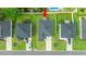 A close aerial shot of the houses showing the roofing and the well manicured lawns at 155 Marsh Deer Place, Surfside Beach, SC 29575